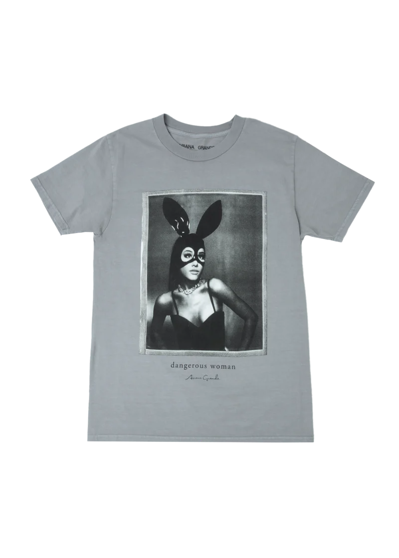 Gray unisex t-shirt featuring a bold black-and-white portrait of Ariana Grande in her signature latex bunny mask and bustier, with “dangerous woman” and her signature printed below — iconic look from her Dangerous Woman album.