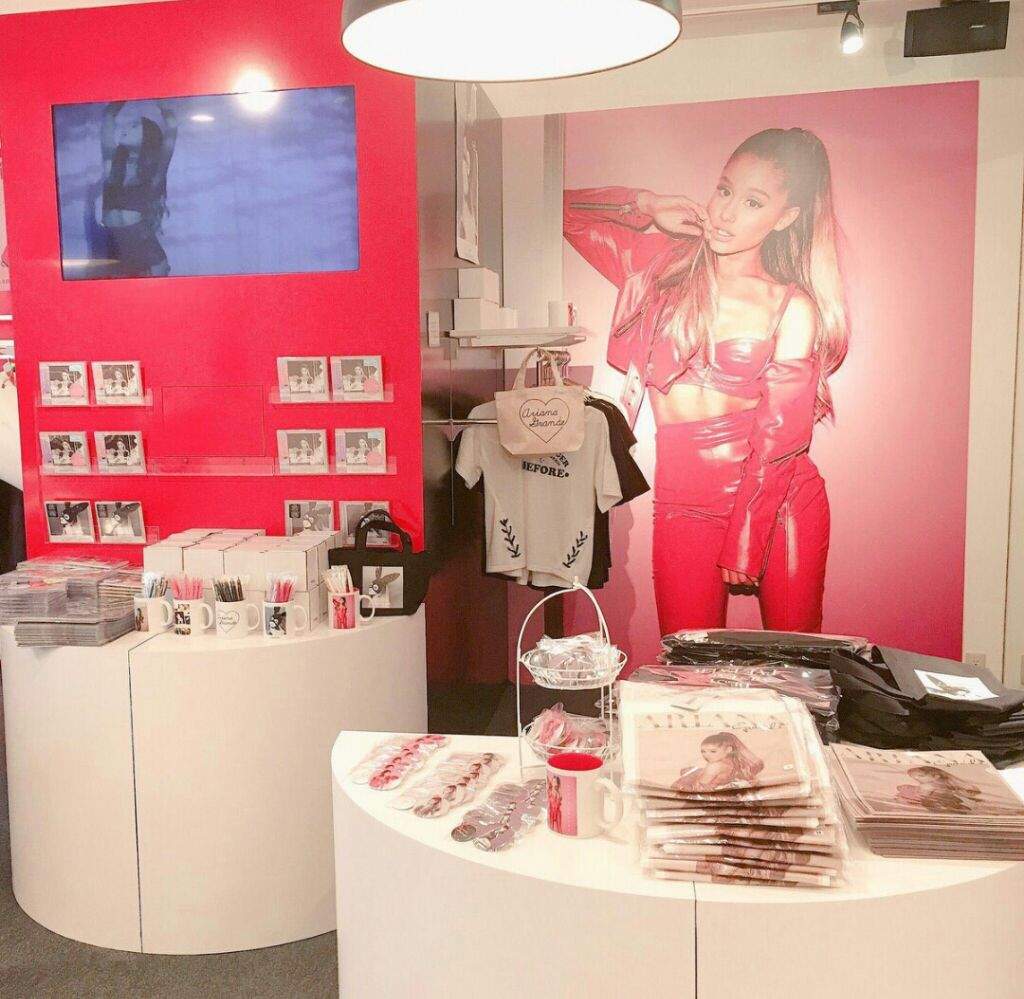 Clothing and fan merchandise arranged on display inside a shop.